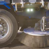 Street sweeping vehicle with rotating side brush cleaning surface