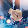 Business professionals shaking hands with digital financial growth graph and city skyline