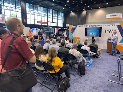 Conference presentation at Exhibitor Solutions Theater with audience seated