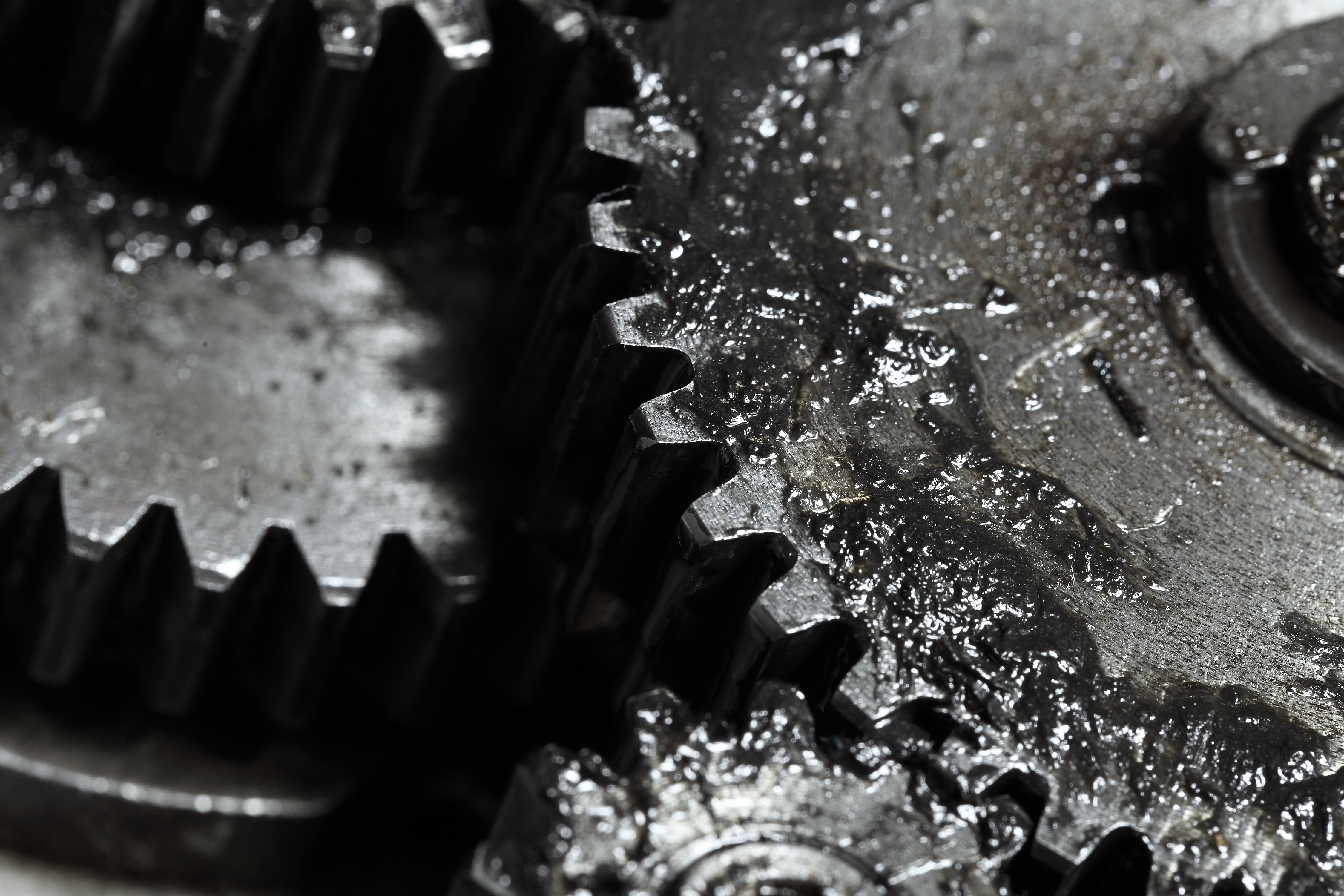 Close-up of interlocking metal gears with textured surfaces