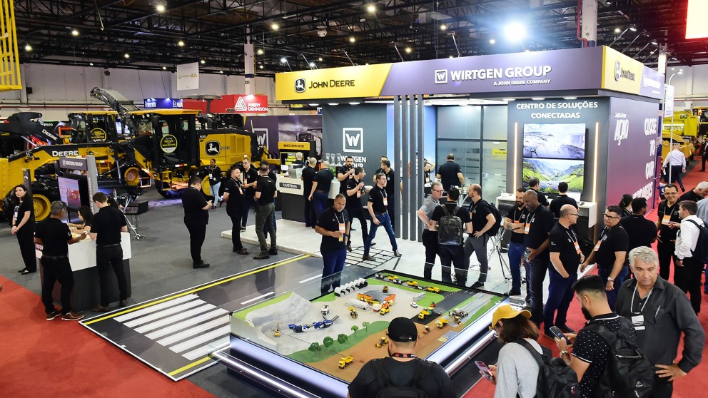 Construction equipment trade show with John Deere and Wirtgen Group displays