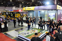 Construction equipment trade show with John Deere and Wirtgen Group displays