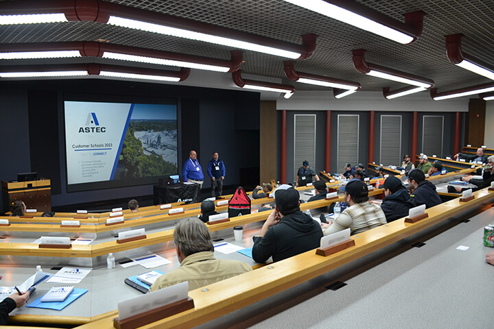 Corporate conference room with presentation about ASTEC Customer Tactics
