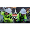 Ergodyne work safety gear logo on high-visibility construction worker background