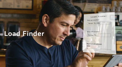 Logistics professional reviewing Load Finder shipping document