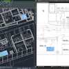 Technical architectural CAD drawings of building floor plans on dual computer screens