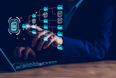 Digital hand interacting with file folder network on laptop screen