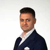 Professional man in navy double-breasted suit with white shirt