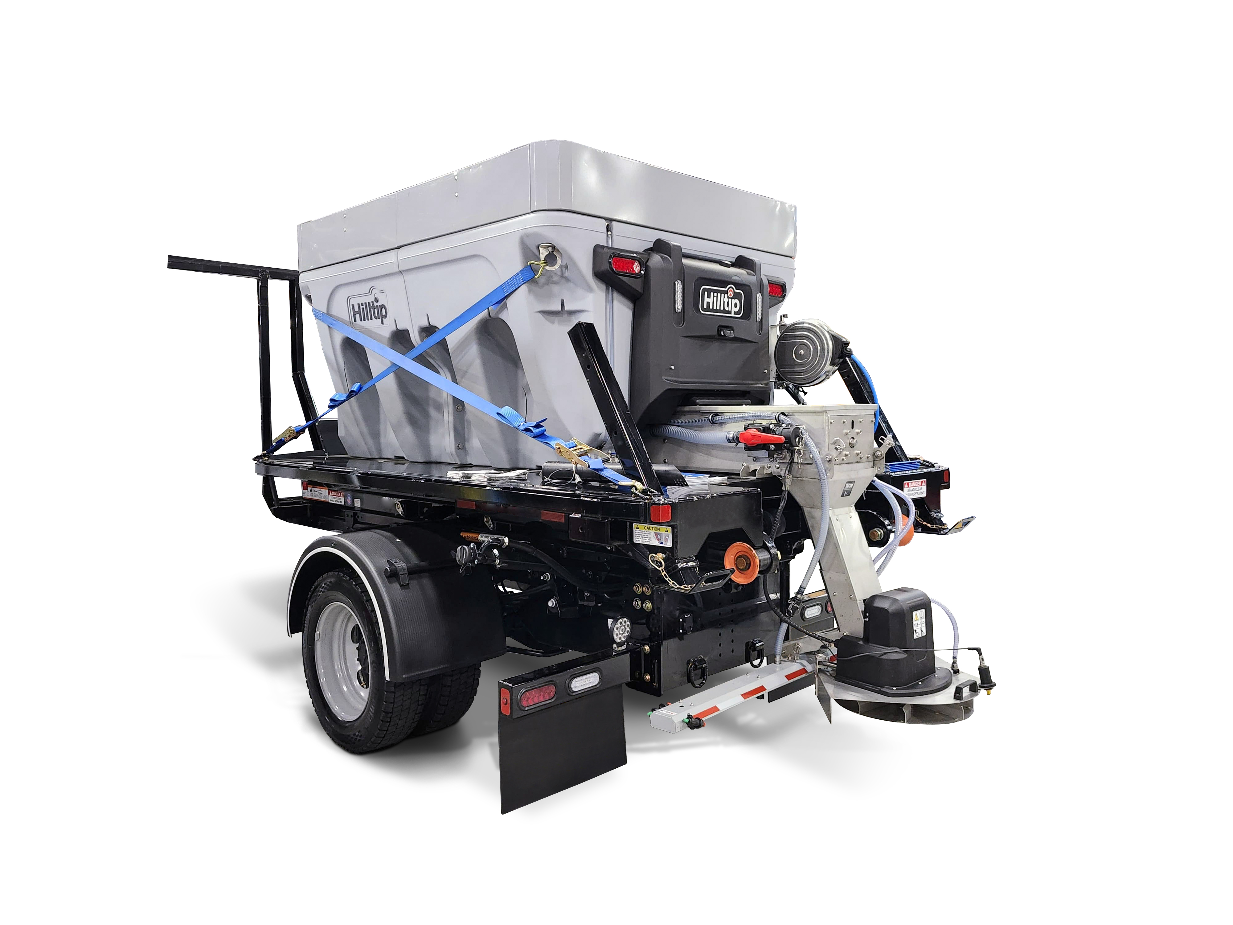 Industrial snow spreader truck with gray hopper and mechanical spreading equipment