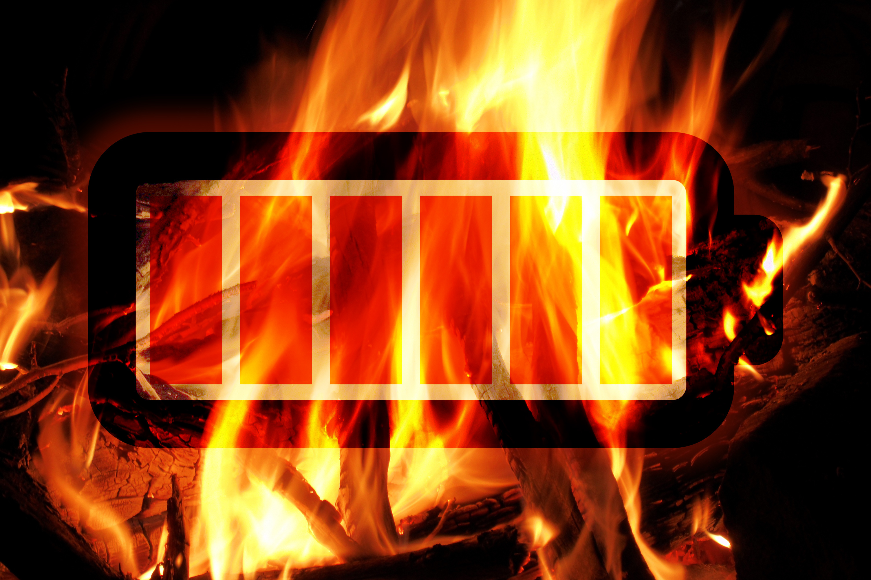 Battery icon with full charge bars against a dramatic background of intense orange and yellow flames