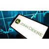John Deere logo on smartphone screen with financial market graph backdrop
