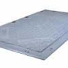 Gray metal industrial floor plate with mounting holes and textured surface