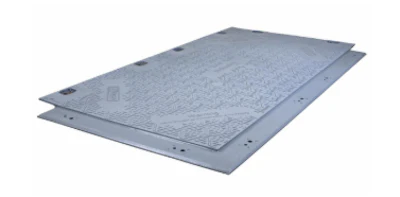 Gray metal industrial floor plate with mounting holes and textured surface