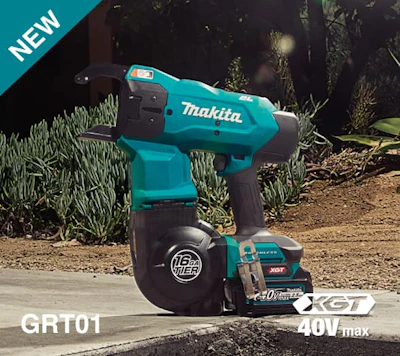 Makita 40V cordless power tool on concrete with battery, surrounded by plants