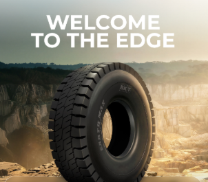 Heavy-duty truck tire displayed against desert landscape with 'Welcome to the Edge' text overlay