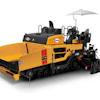 Yellow industrial road paving machine with extended conveyor and umbrella canopy