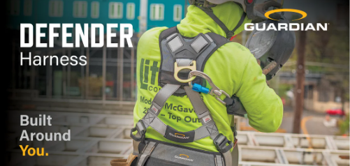 Construction worker wearing high-visibility yellow safety harness with Guardian branding