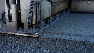 Industrial machinery edge with metal components and textured surface