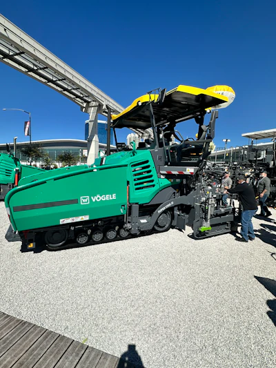 Vögele green asphalt paver with yellow hopper at construction equipment exhibition