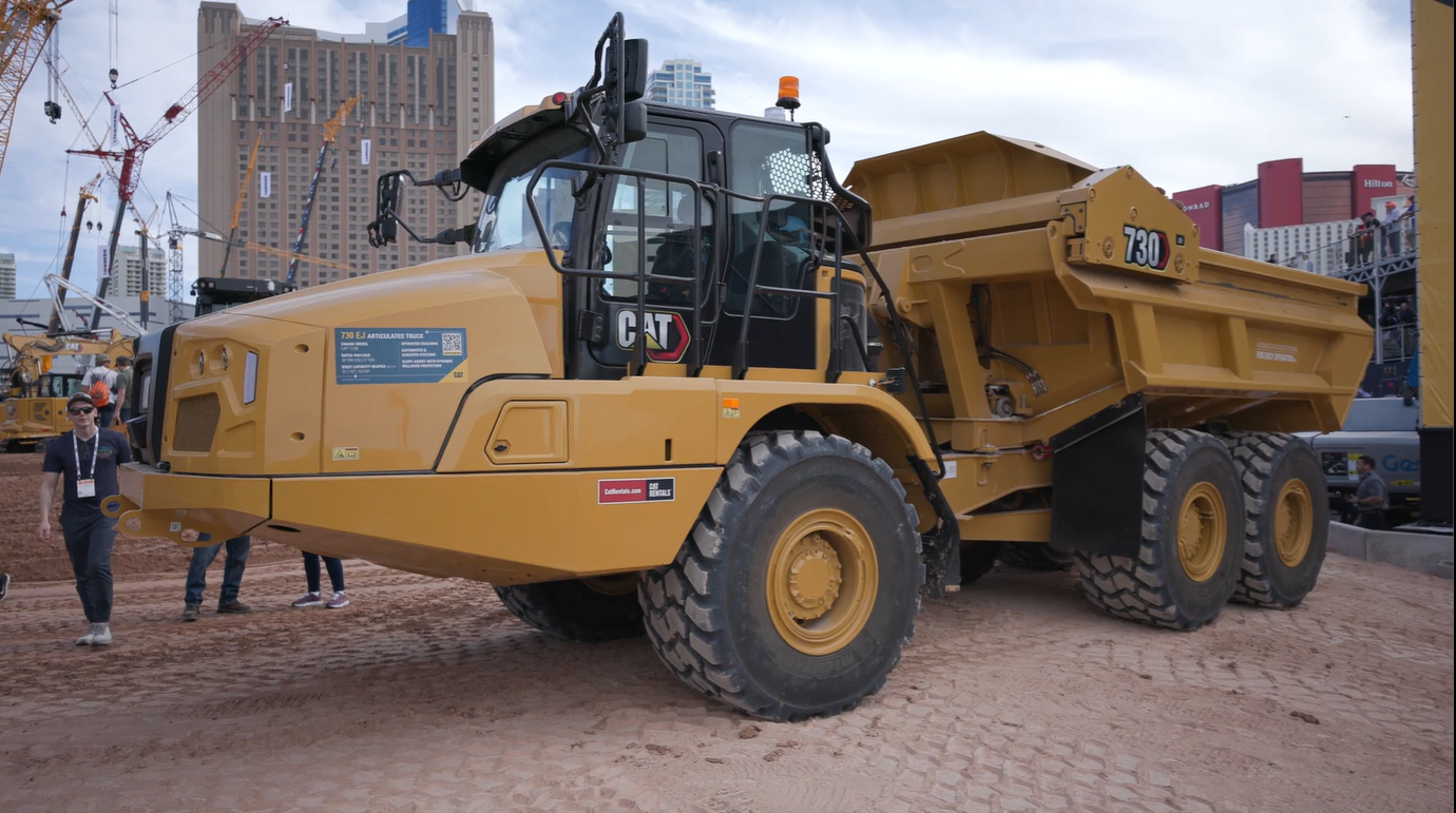 Yellow Caterpillar 730 articulated dump truck on display at urban construction equipment exhibition