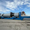 Large blue industrial dryer unit mounted on multi-axle trailer in outdoor lot