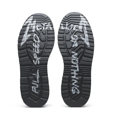 Saucony running shoe sole with tread pattern and brand text imprint
