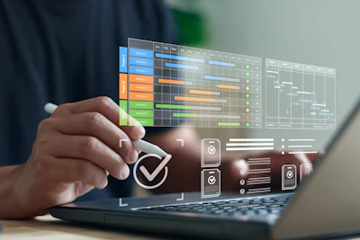 Professional using laptop with holographic project management dashboard displaying colorful timeline charts and task checkmarks