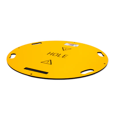 Yellow circular safety mat with 'HOLE' text and warning triangles for construction or utility use