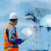 Construction worker holding tablet with AI control technology visualization and digital interface overlays