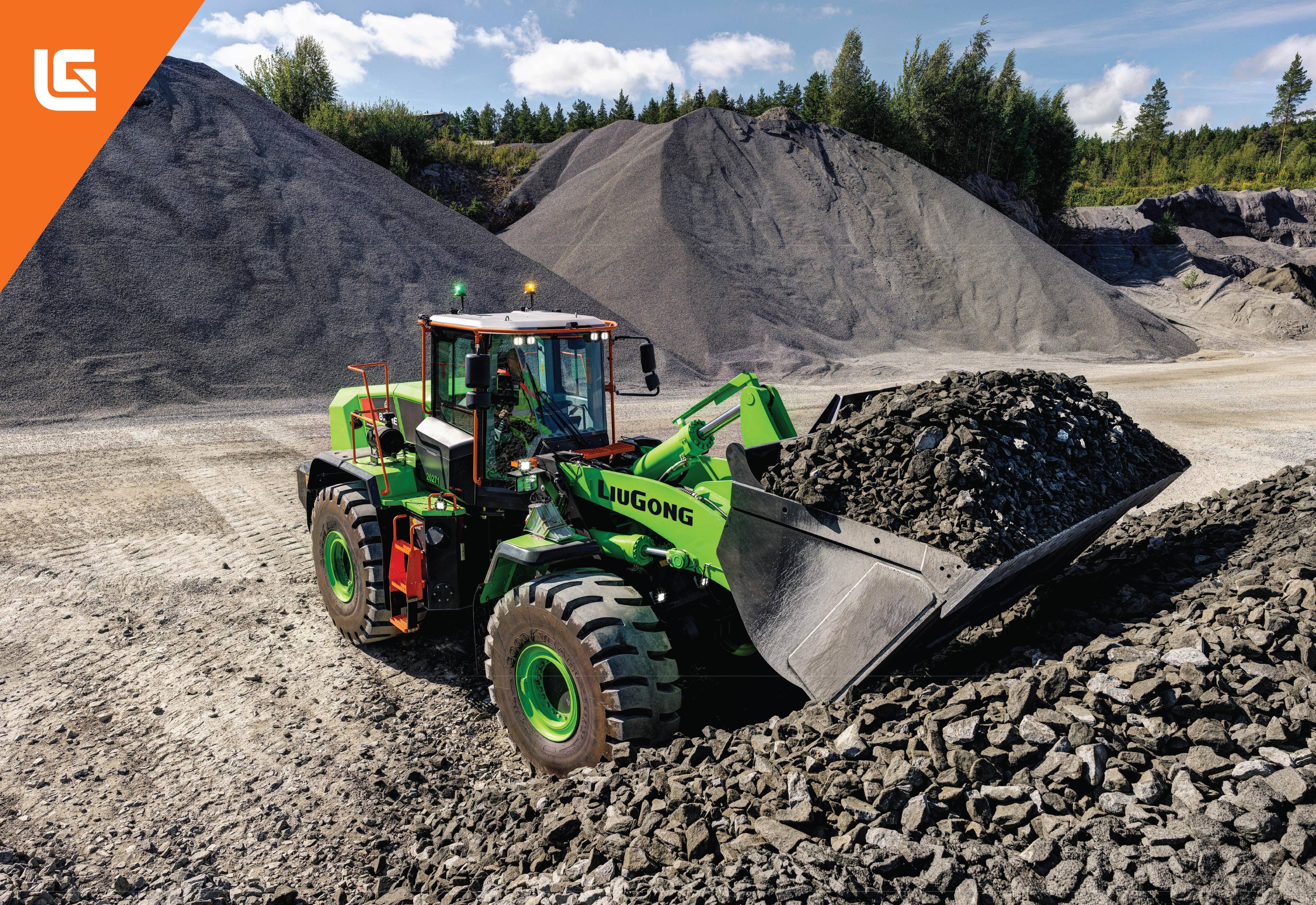 Bright green LiuGong wheel loader moving aggregate materials at a quarry with large gravel piles and forested hills in background