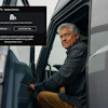 Truck driver in cab with software update dialog displaying stay and start up or lock and start up options
