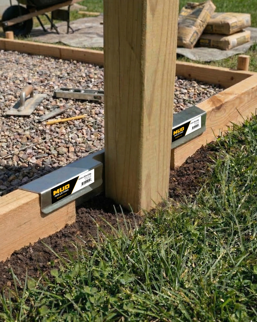 Wooden raised garden bed corner brackets with Mitre branding installed on gravel and soil base