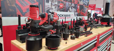 Rockwave industrial tools and equipment display on red workbench at trade show booth