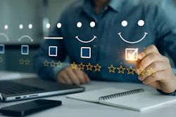Person selecting five-star rating on customer satisfaction feedback survey displayed on laptop screen