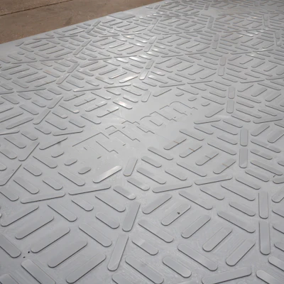 White embossed rubber mat with repeating geometric rectangular pattern for slip resistance and durability