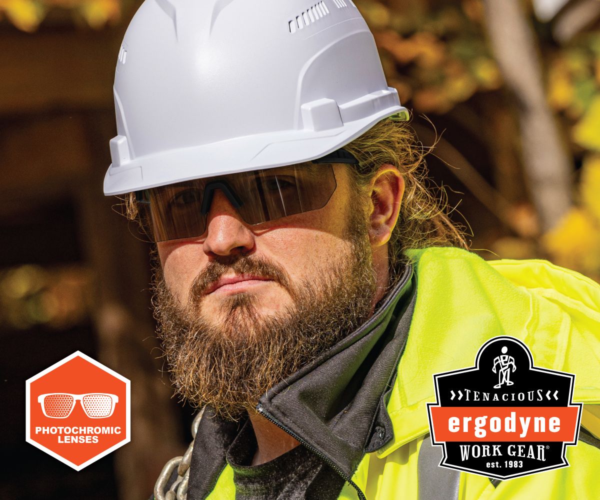 Construction worker wearing white hard hat, dark sunglasses, and neon yellow safety vest with Ergodyne branding