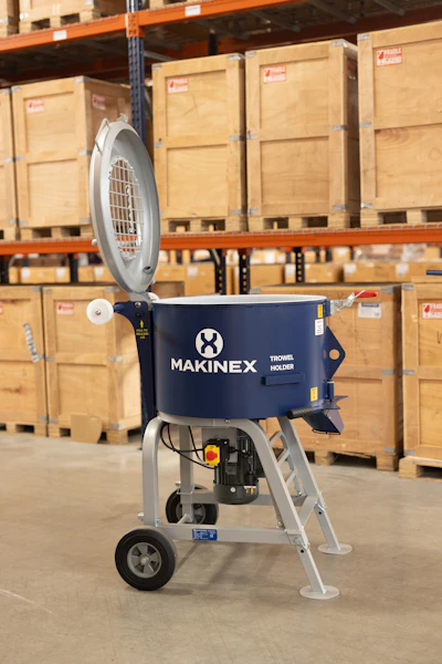 Makinex trowel holder mixer displayed in warehouse with wooden shipping crates