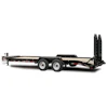 Black gooseneck flatbed trailer with dual axles and hydraulic ramps for equipment hauling