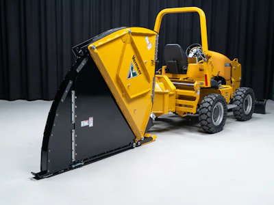 Yellow Vermeer wood chipper with black hopper attachment on white floor