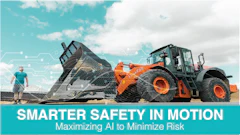 Orange wheel loader dumping gravel with worker and digital safety overlay on turquoise sky background